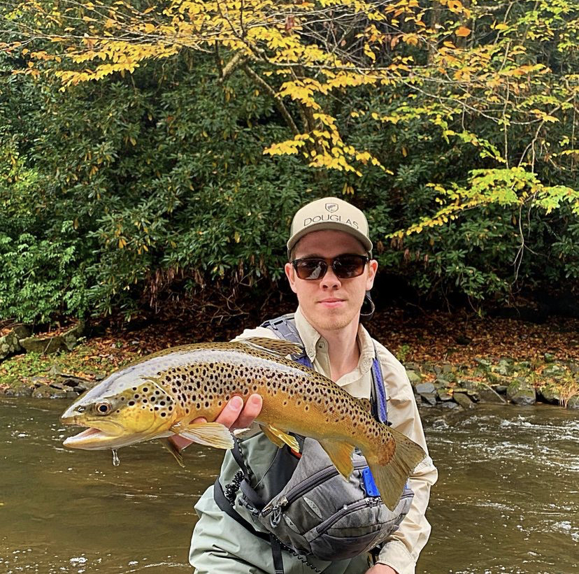 Angler Brayton Bird with a brown trout