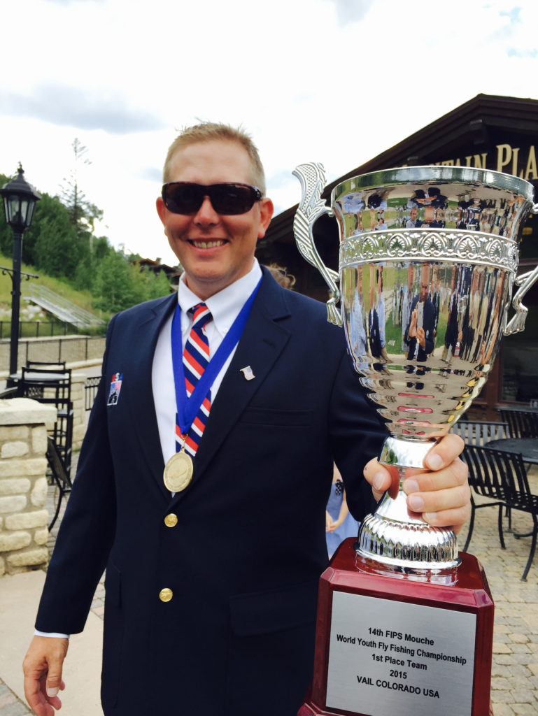 Chris Smith with a trophy cup at the world youth fly fishing championships