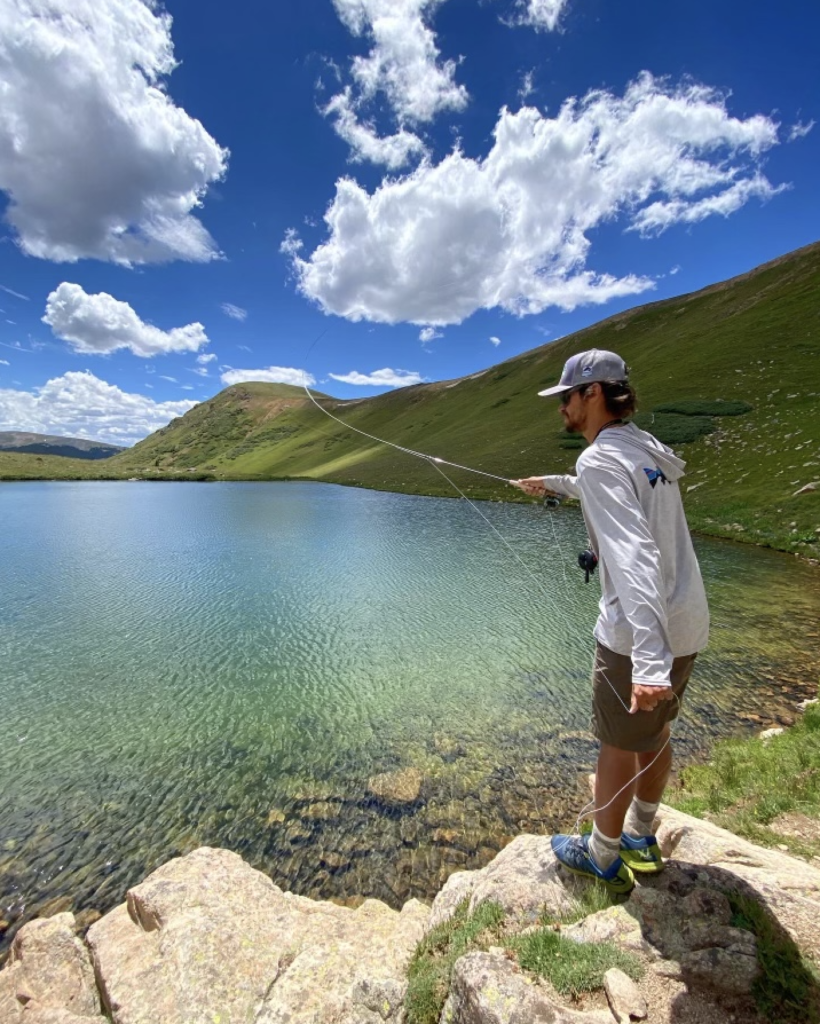 Cody Burgdorff casting on an alpine lake