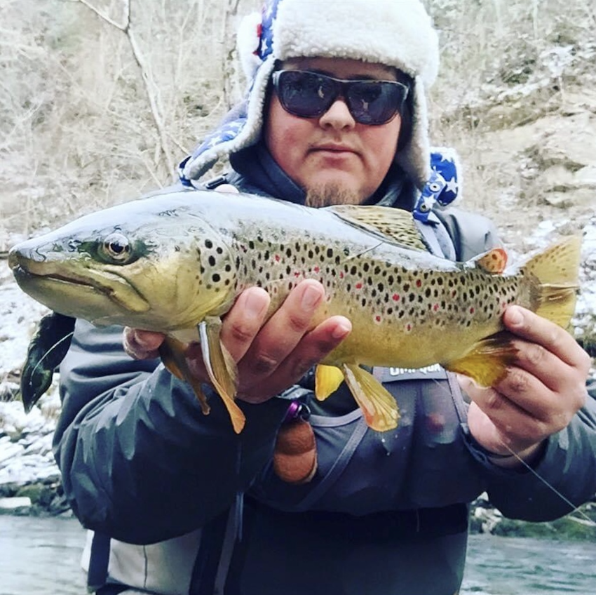Michael Bradley with a large brown trout